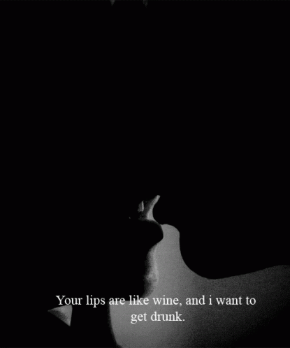 a black and white po of a person's face, with the words your lips are like wine, and i want to get drunk