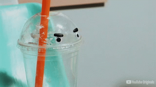 a plastic cup with straws, a straw holder and plastic straw