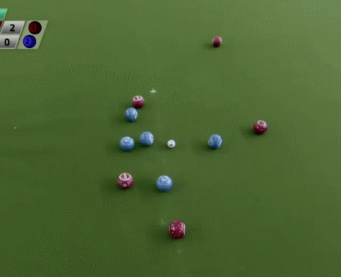 a large number of different colored items on a green surface