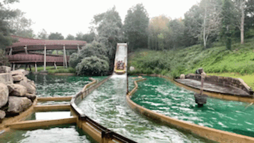an image of a water slide going over the edge