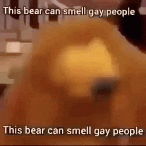 a cartoon bear in blue with words saying, this bear can smell gay people
