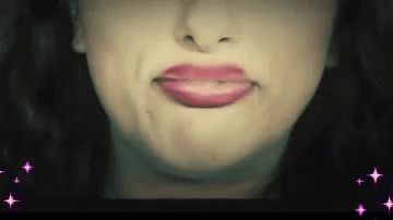 a woman's lips and the face are painted white