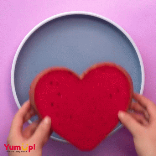 a heart on a dish of someone holding it