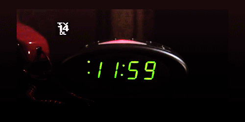 an alarm clock with the time 11 55