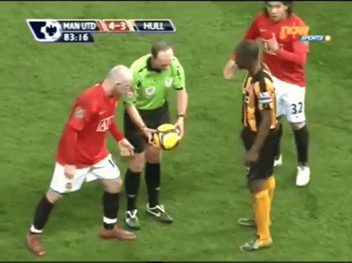 a referee showing off some players on the field