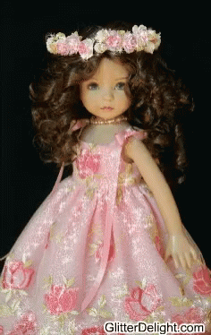 a doll wearing a dress and a tiara