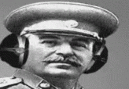 a man in uniform with headphones is in a vintage po