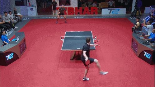 tennis players are on an indoor court at a tournament