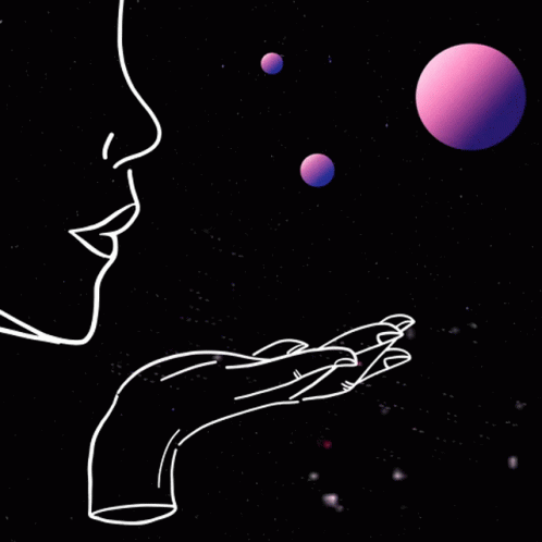 a person with their hand out towards some red spheres in space