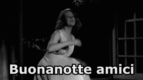 a woman in a long white dress with the words benanotte amici on it