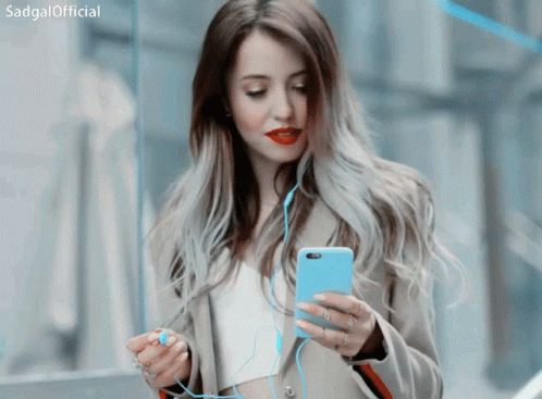 a woman with blue lipstick using a cell phone