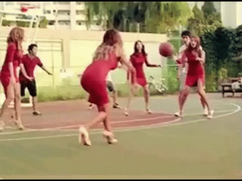 this is a still image of some girls playing basketball