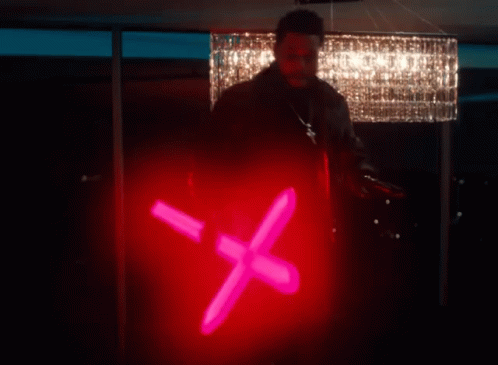a person standing next to a light with an x on it