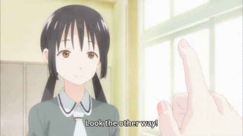 a girl with long brown hair is giving the peace sign