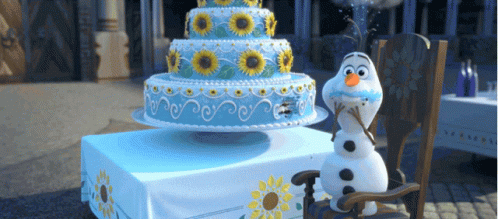 a frozen snowman and his birthday cake