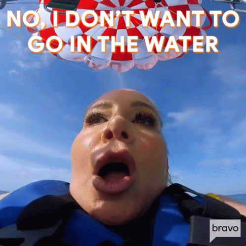 a blue man with his mouth open with text that reads, no i don't want to go in the water