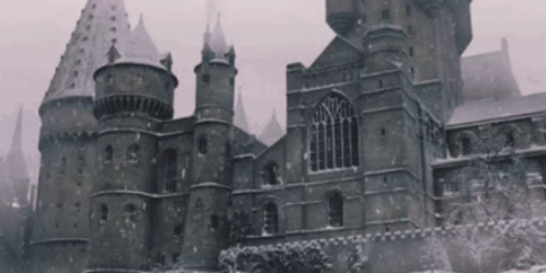 old gothic castle in winter storm on cloudy day