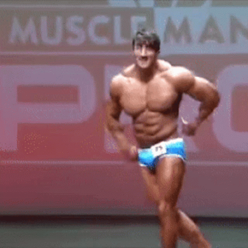 there is a man dressed like a muscle man posing