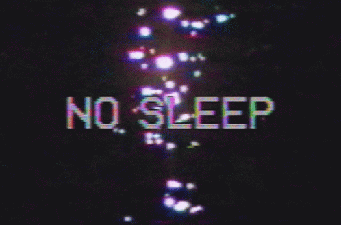 no sleep sign with white letters and a street light