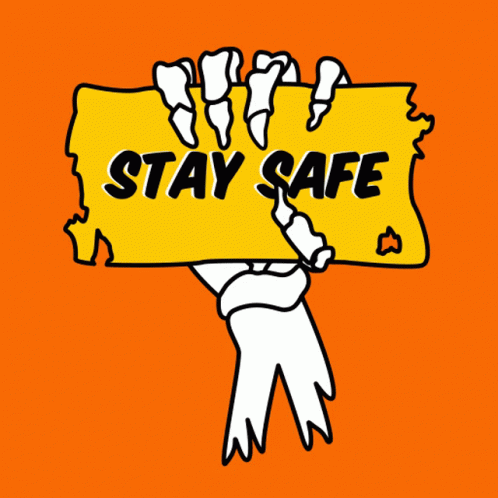 a person holding a sign that says stay safe