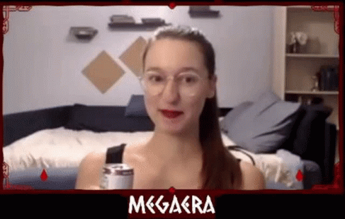a girl with a soda looks at the camera