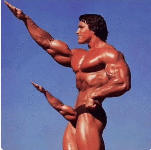 a bodybuilding athlete in blue, pointing his finger forward