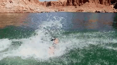 a person surfing a wave in the water