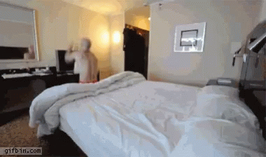 a blurry view of a bed in the middle of a room