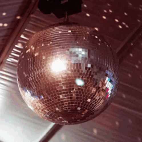 large shiny disco ball hanging from the ceiling