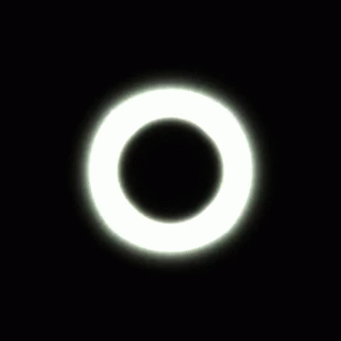 an object with black background and a white circle in the center