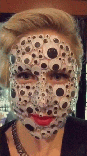 woman with large black dots over white face