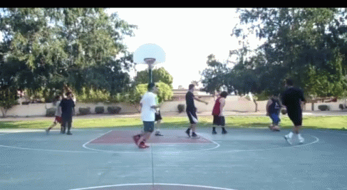 some people are playing basketball and doing stunts