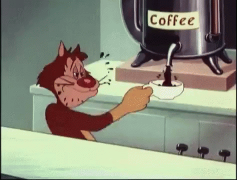 cartoon cat sitting on counter next to coffee pot