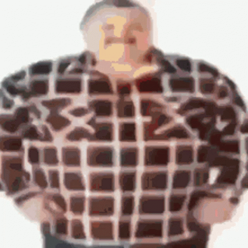 man wearing a blue and black checkered shirt with long sleeves
