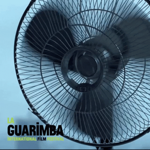 a black fan sitting on top of a table