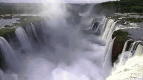 the waterfall is spewing water into the water