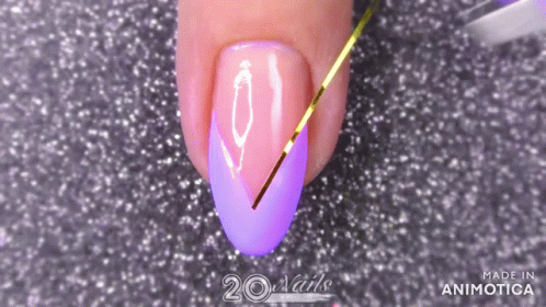 nail with pink and purple colors with arrows on it