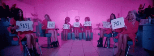 several mannequins sitting on chairs while holding signs reading pay, pay, pay