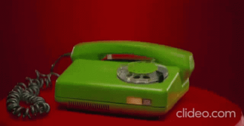 the cord is attached to the green phone