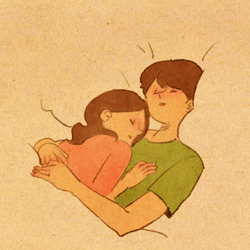 a couple is cuddling and smiling while they are lying on top of each other