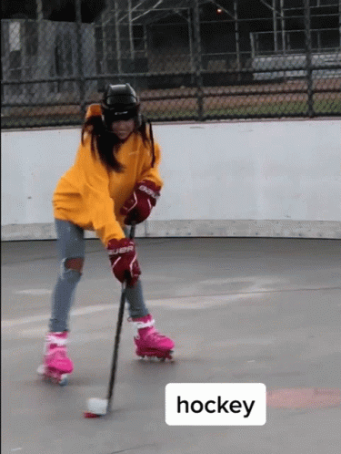 an image of a person on a street playing hockey