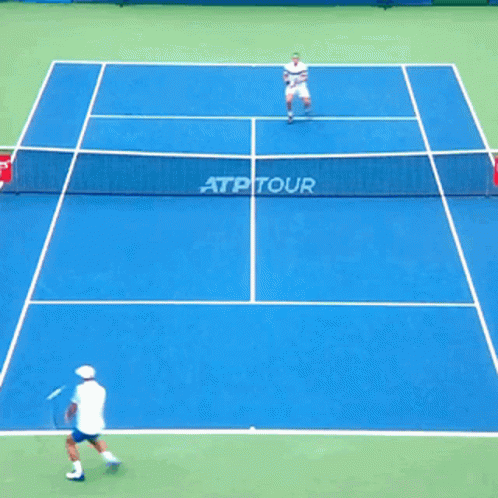 a group of people are playing a game of tennis