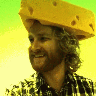a man with a fake cheese on his head