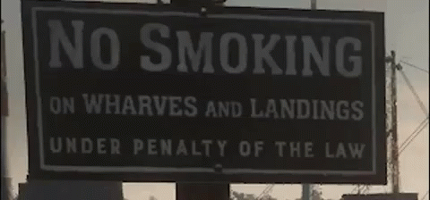 a sign warning no smoking on whatever and landings under penalty of the law