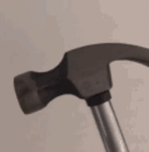 an old hammer with an extra handle in the middle