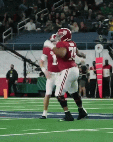two football players are getting ready to fight