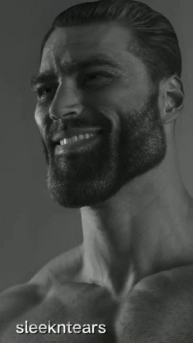 man with beard smiling at the camera looking back