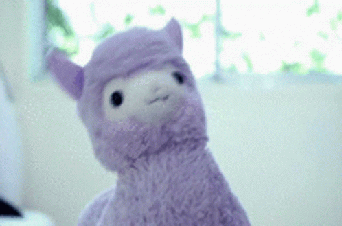 the stuffed animal is in pink yarn