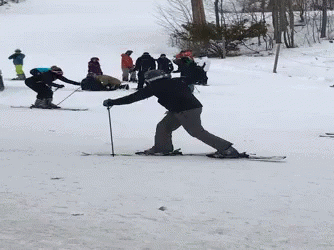 some people are skiing on the snow with their gear
