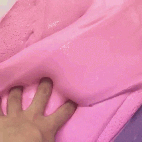 a hand sticking it's fingers through the side of a bed